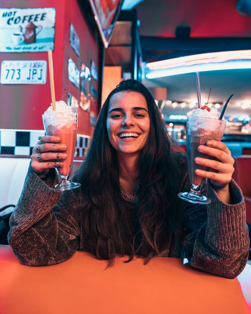 woman drinking milkshake